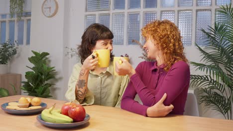 two women having breakfast at a table