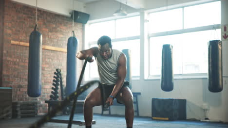Gym,-battle-rope-and-black-man-with-training