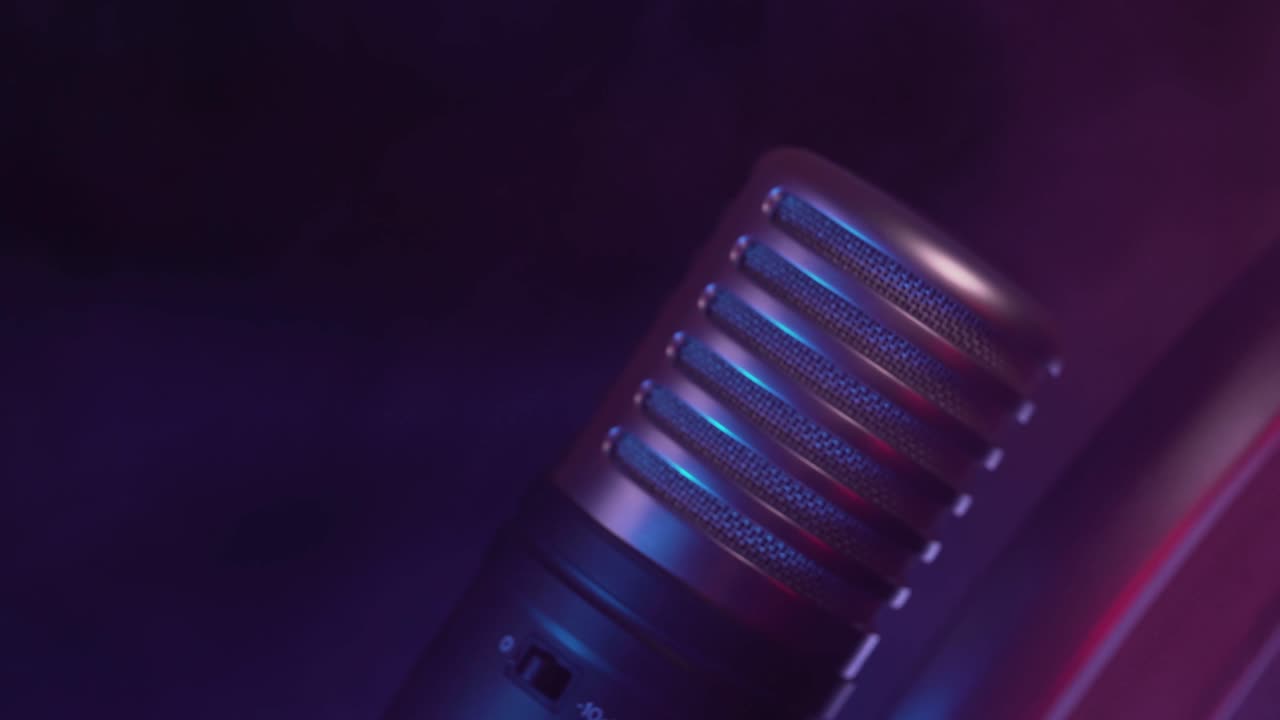Studio Microphone Coming into Focus with Neon Lights