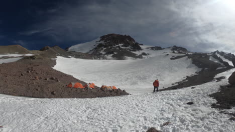 person walking towards tents in camp 3 on aconcagua