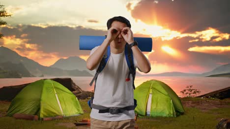 man camping at sunset
