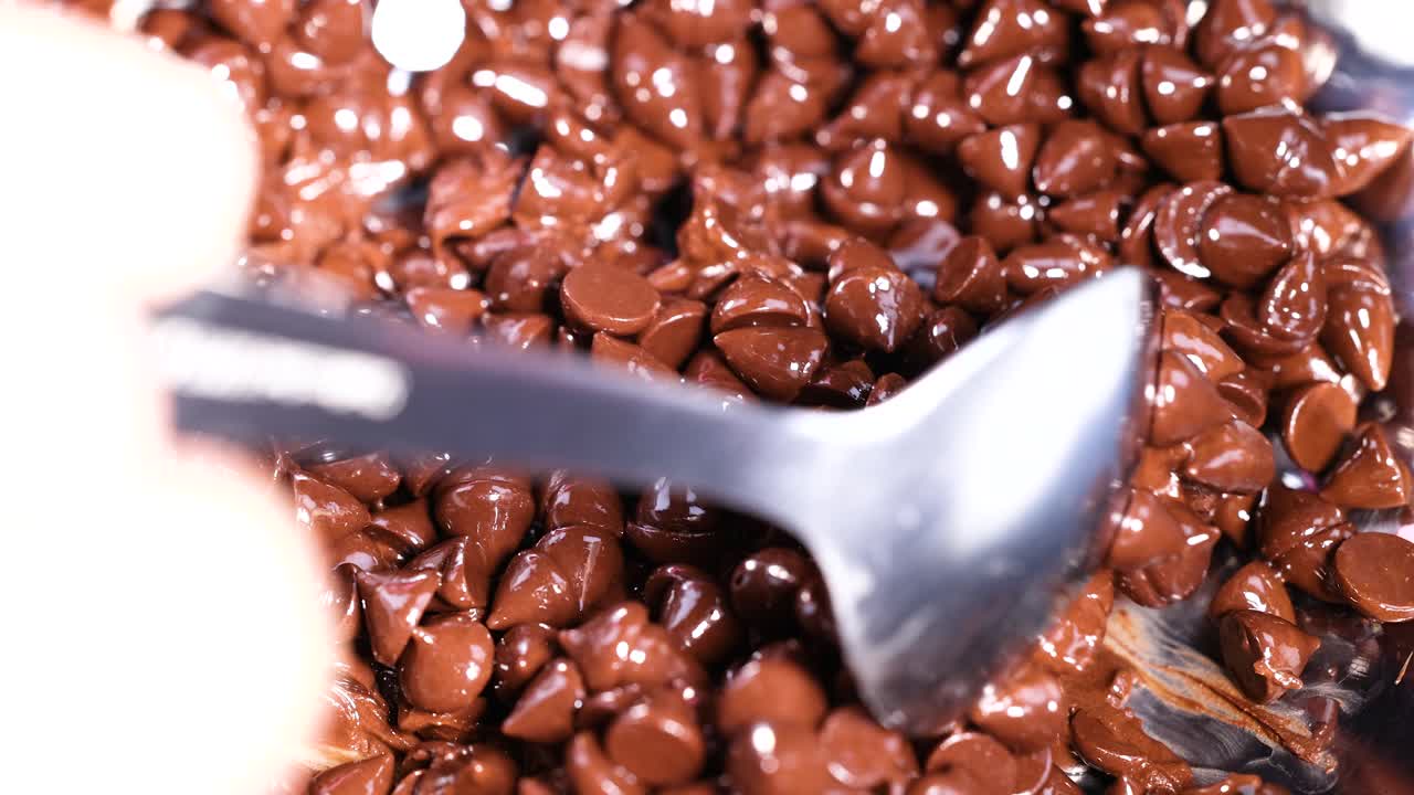 Mixing chocolate chips with a spoon