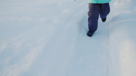 Carefree-Child-Trips-Out-On-Snow-Covered-Path