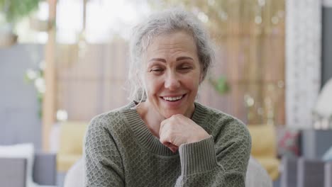 Happy-senior-caucasian-woman-making-video-call-in-garden,-slow-motion