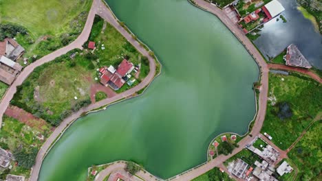 Almoloya-Lagoon-surrounded-by-small-houses,-typical-view-of-a-Mexican-small-village