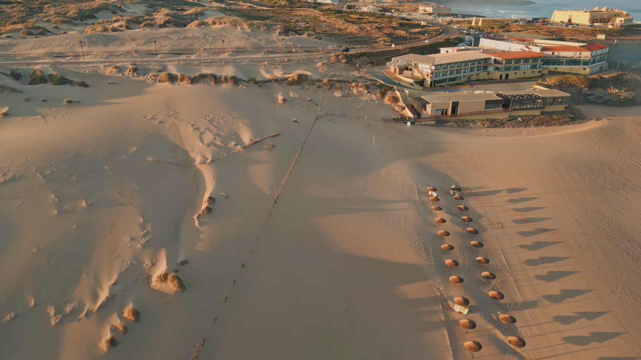 Aerial view resort city at summer sunlight. Drone panorama cozy beach complex