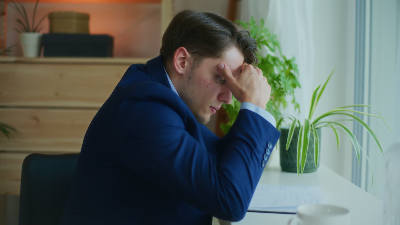Worried Businessman Working on Project