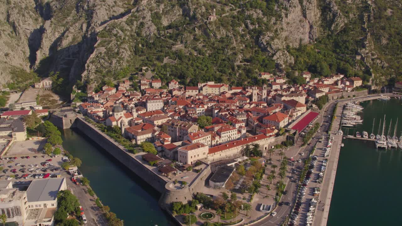 Medieval harbor town Kotor with mountain background in Bay of Kotor, aerial
