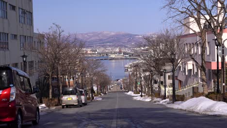 famous view of hachiman-zaka slope towards hakodate port in hokkaido during winter