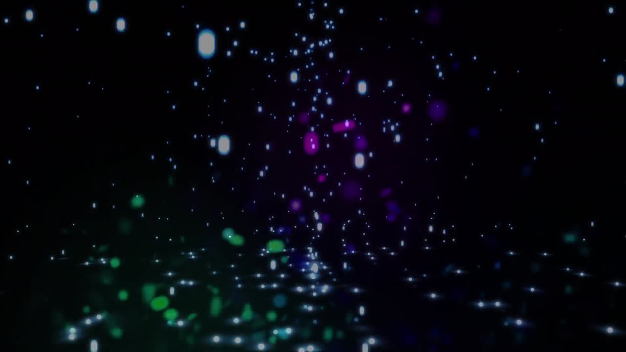 Animation of colorful glitter particles and lens flares moving in seamless loop on black background