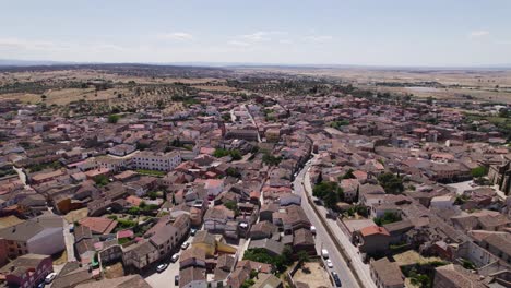 establishing aerial view over oropesa neighbourhood houses in the scenic spanish countryside