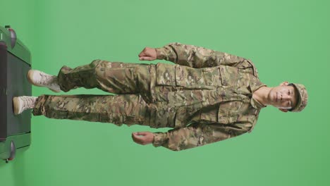 full body of asian man soldier walking in the green screen background studio