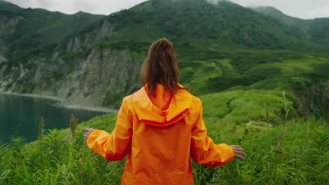 woman hiking in a scenic coastal mountain landscape
