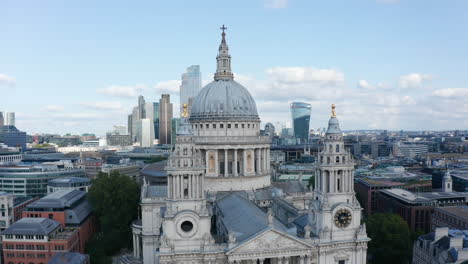 Elevated-view-of-turrets-a-dome-of-Saint-Pauls-Cathedral-with-group-of-modern-office-building-in-City-financial-hub-in-background.-London,-UK