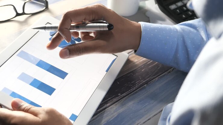 Businessman analyzing data on a tablet