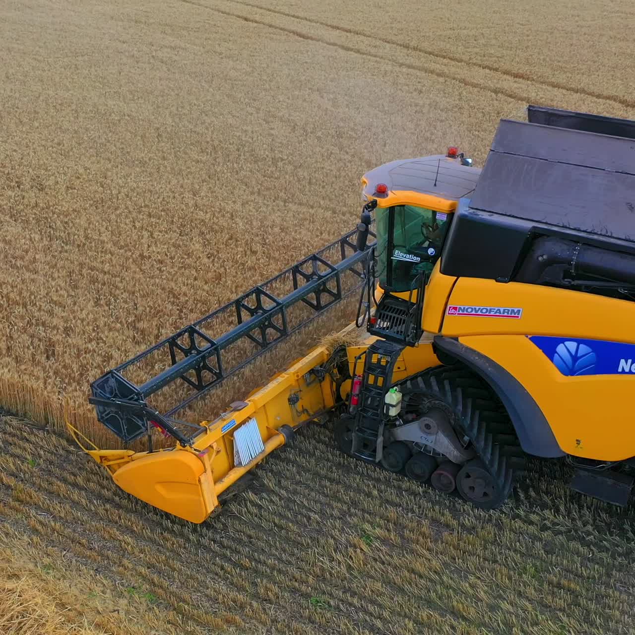 Combine harvester working on a wheat field. Combine harvester Aerial view