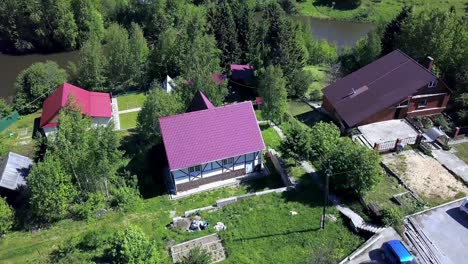 aerial view of a village with houses and a river