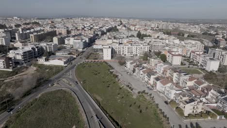 Altamura,-Italy-skyline-with-highway-and-traffic-with-drone-video-moving-sideways