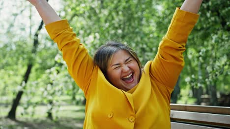happy woman celebrating outdoors