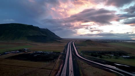 cloudy sunset sky over route 1 in south iceland with selfoss town in backdrop