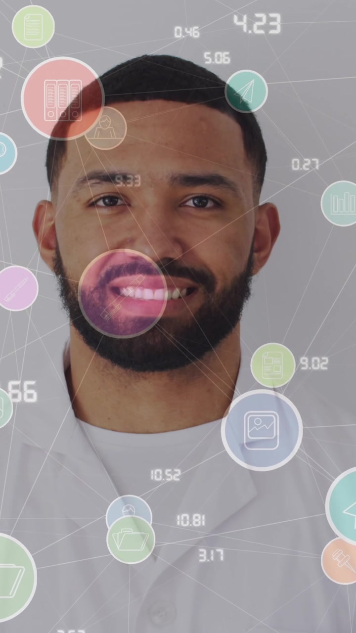 Animation of network of connections with icons over man smiling at camera