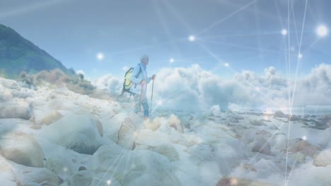 caucasian senior man hiking in countryside, over fast moving clouds and network of connections