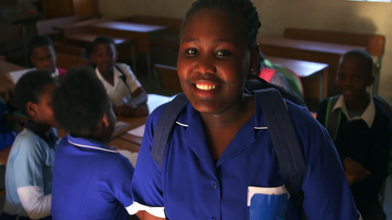 Portrait of a young schoolgirl smiling 4k