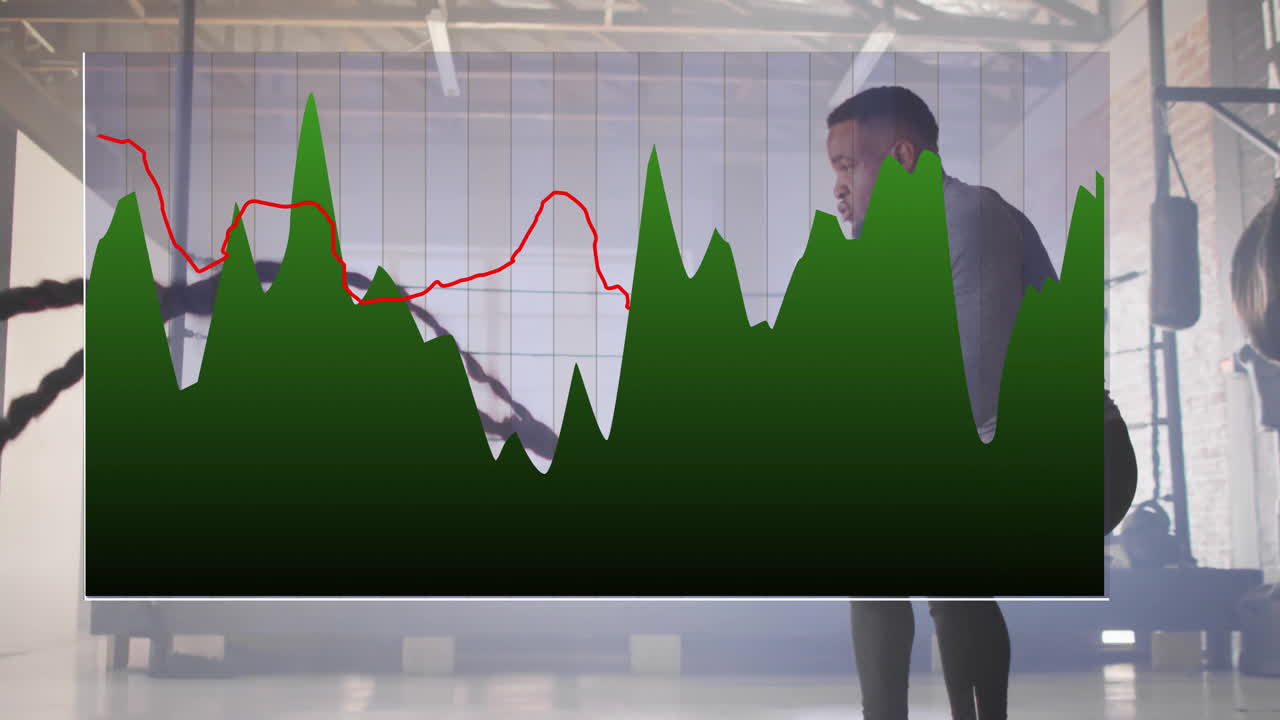 Man exercising with ropes overlaid by fluctuating green and red graph animation