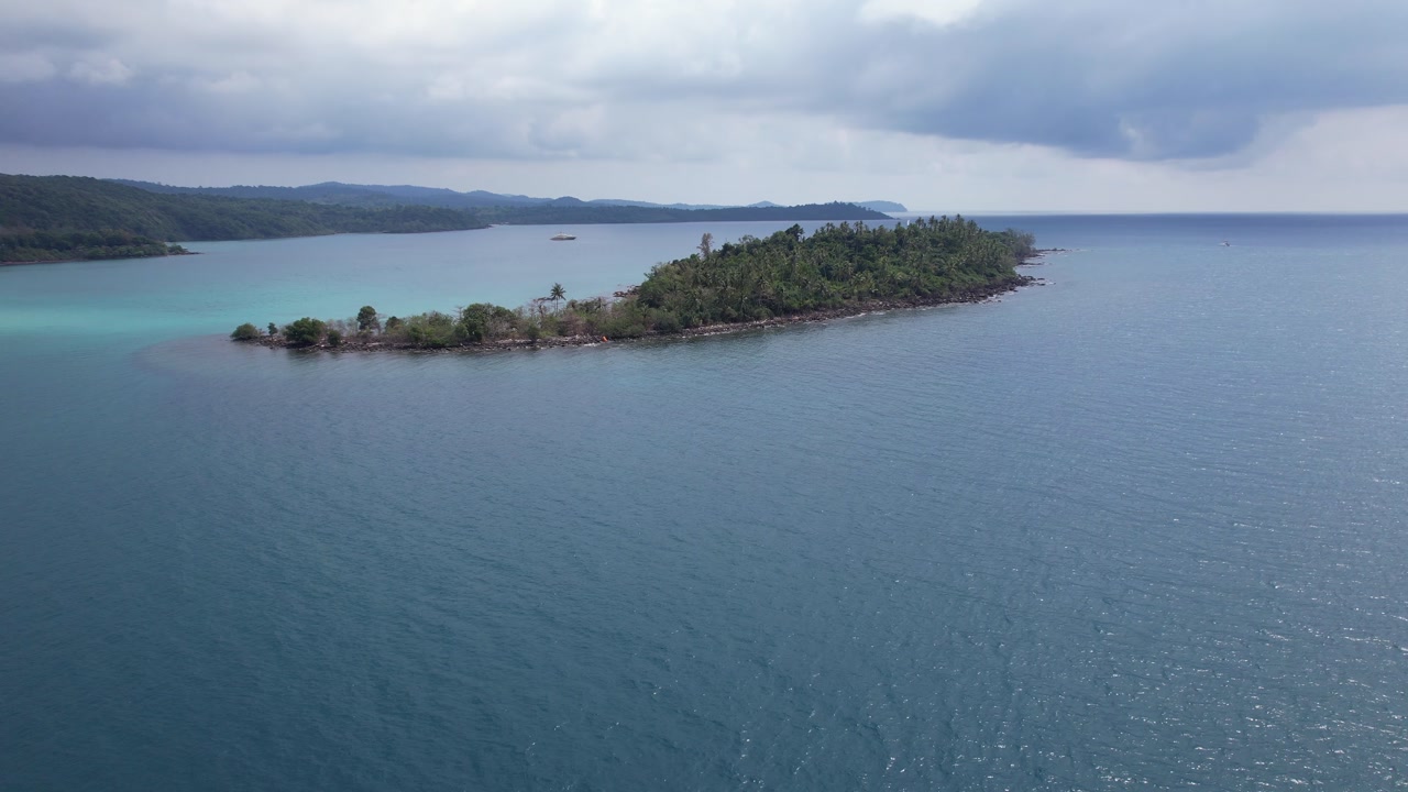 Ko Raet Island By The Calm Blue Sea - Koh Kood, Trat, Thailand. - aerial shot