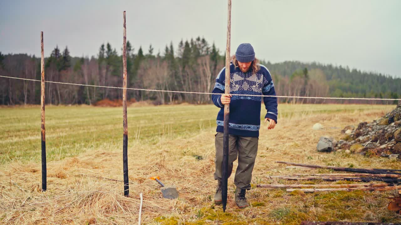 Man Constructing Wooden Fence (Skigard) In Norway - Wide