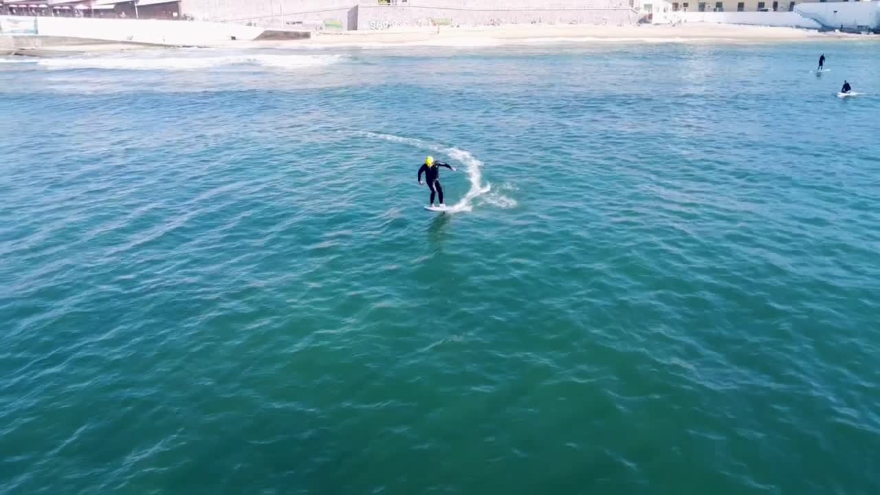 Man Riding an eFoil on the Ocean