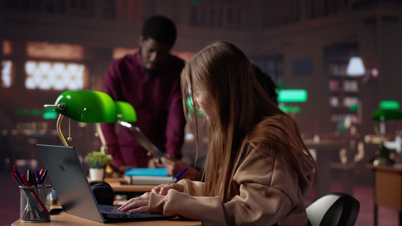 Vertical video college student captivated by literature assignment at the academic library