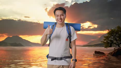 asian male hiker with mountaineering backpack smiling and showing thumbs up gesture to camera at a lake