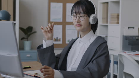 woman in business attire on video call