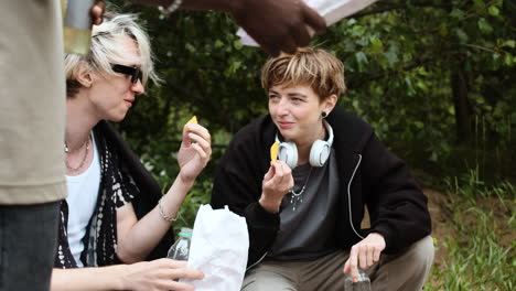 rock band members talking outdoors