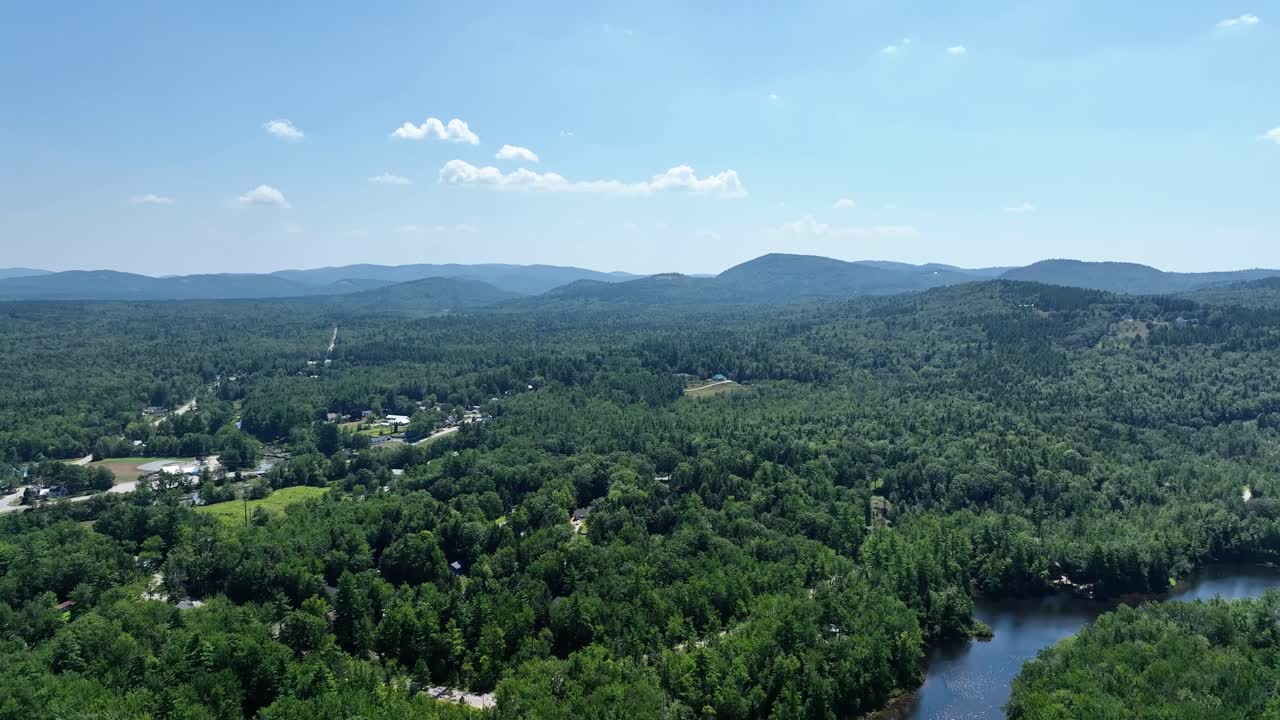 Drone view of the White Mountains and Saco River in New England on a sunny day