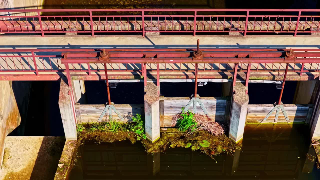 Pullback from spillway water control system by dam structure in Jaunpils, Latvia, scenic view