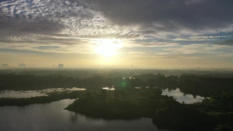 sunrise over a city and lake