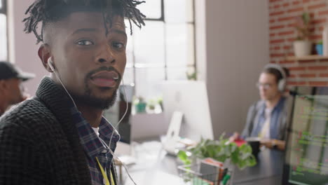 portrait-african-american-man-programmer-coding-network-security-software-for-startup-company-professional-web-developer-smiling-enjoying-typing-code-on-computer-screen-in-successful-office