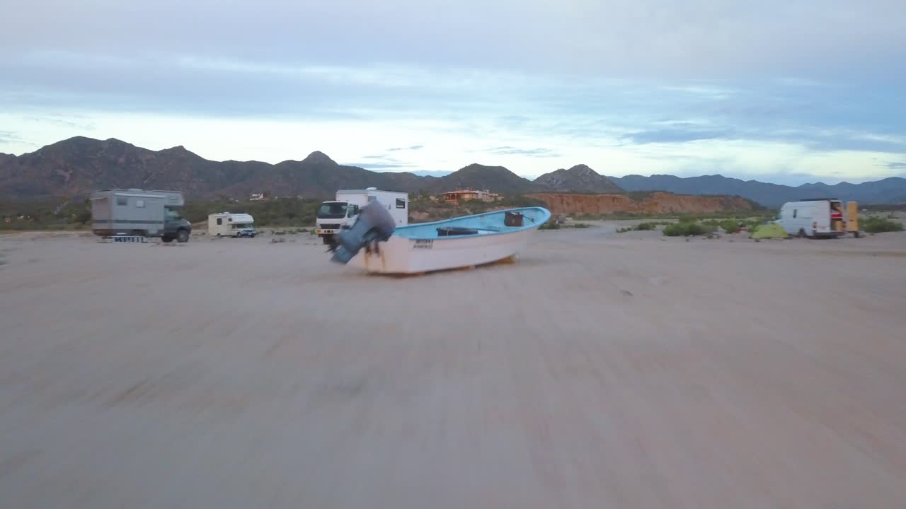 Aerial view coming from the water of a rv parking in Los Frailes beach, Baja California.