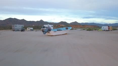 aerial view coming from the water of a rv parking in los frailes beach, baja california.