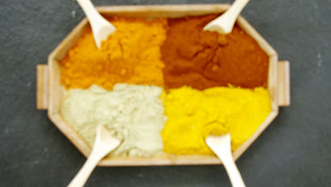 various spices arranged in tray 4k