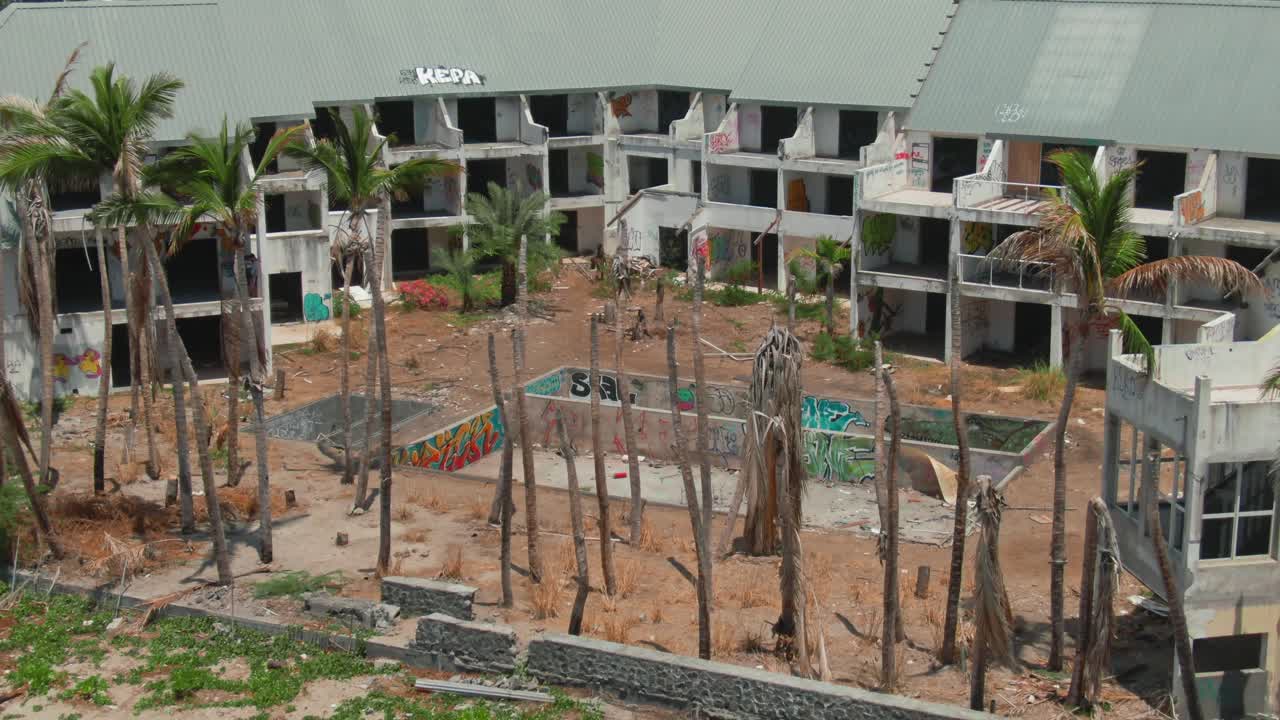 4K Aerial Abandoned hotel on the beach Drone closeup dolly out shot