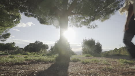 Woman-detoxing-in-nature-spiritually-under-sunlight-gimbal-shot