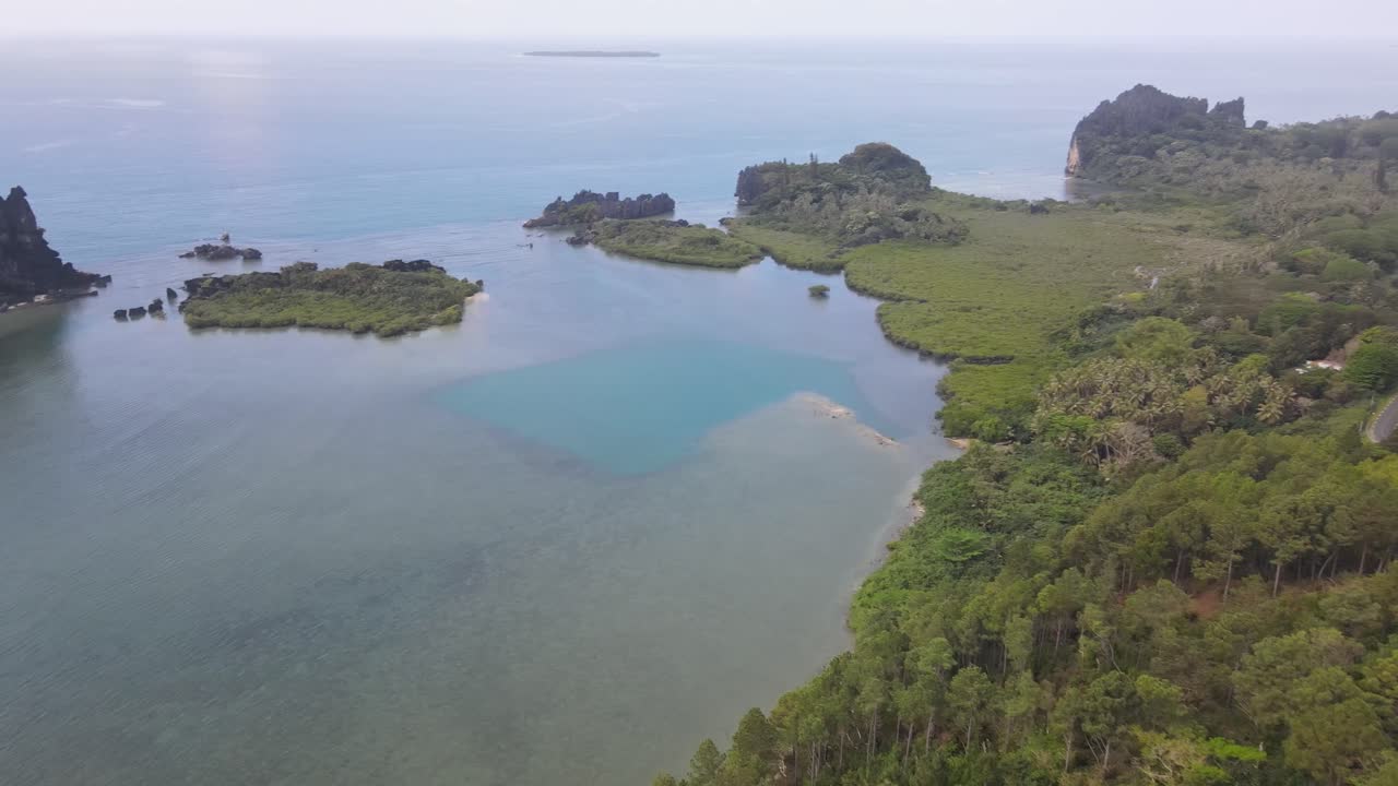 Drone aerial on La Poule in New Caledonia on a cloudy day