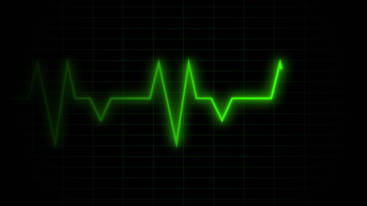 Display digitale verde del monitor della frequenza cardiaca su griglia nera.