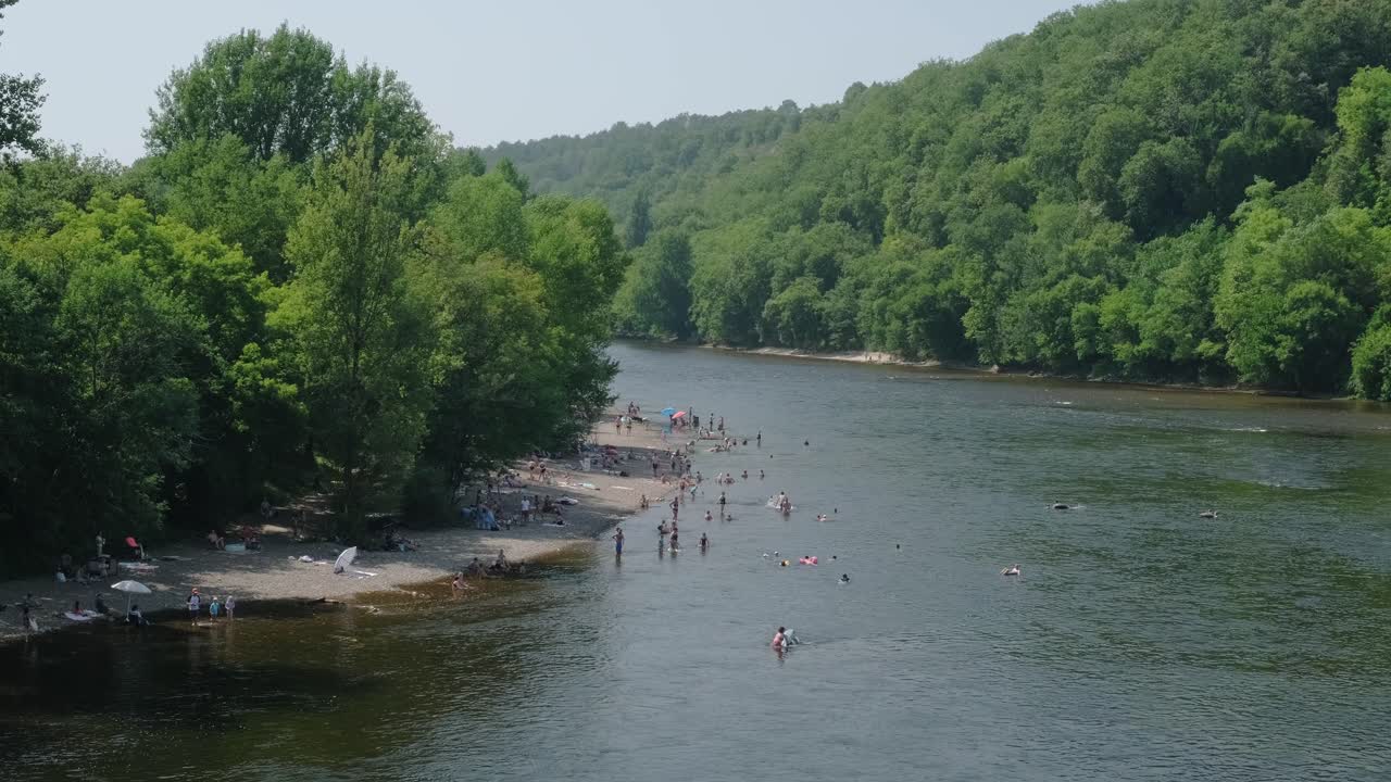 slow motion view of people bathing in a river located in france