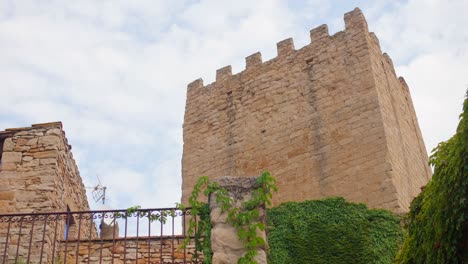 Ruins-of-a-medieval-tower-in-Europe-is-captured-in-a-slider-shot-in-4K