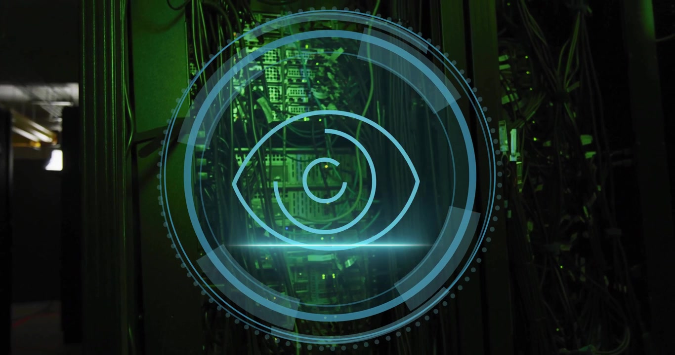 Camera focusing on server rack overlaying cybersecurity shield graphic rings rotating eye scanning