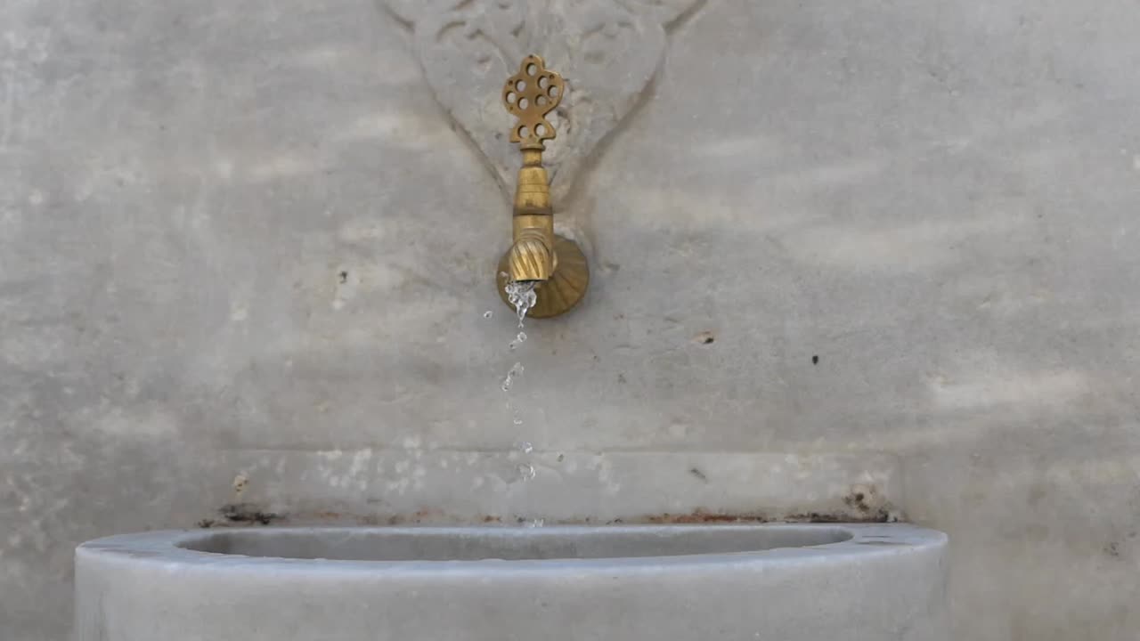 Water flowing from a marble fountain